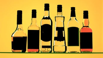 Alcohol: Brain: liquor bottles yellow light yellow background-185088638