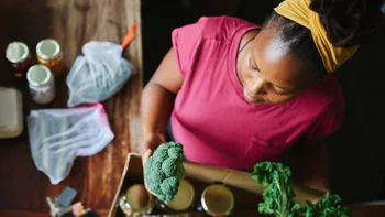 gerd: woman unpacking groceries 1255180633