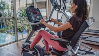 Movement-exercise: woman using recumbent- exercise bike 1304297595