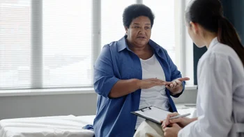 HCP: woman at medical appointment 2261239154
