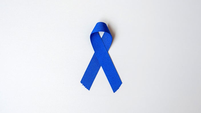 Colorectal Cancer Awareness Month blue ribbon on a white background.