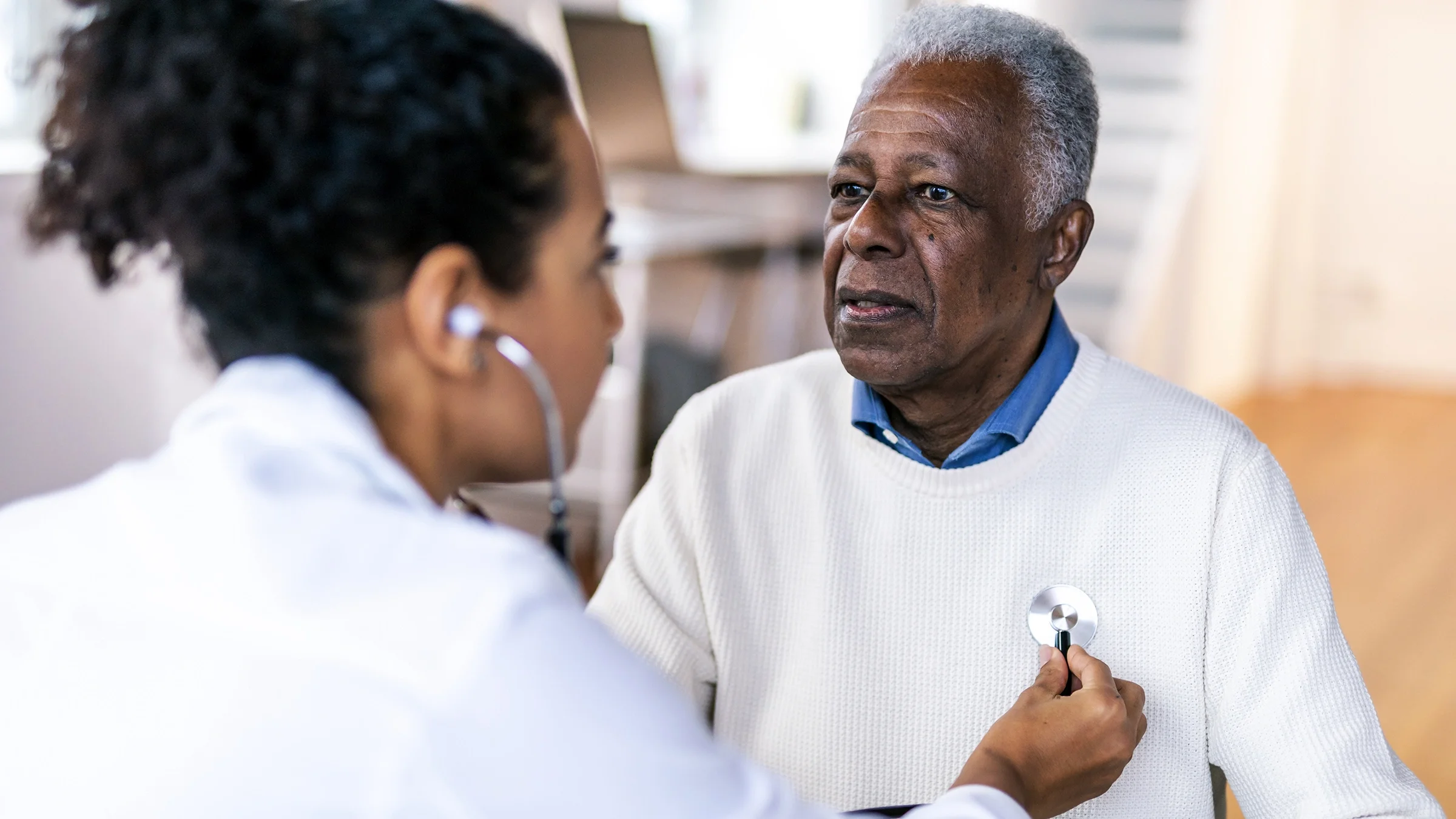 A man undergoes an exam during a routine medical appointment. Experts advise people older than 65 years to get regular checkups and screening tests. 