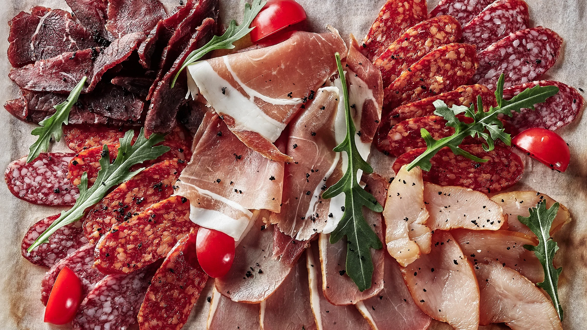 A charcuterie board with cured meats.
