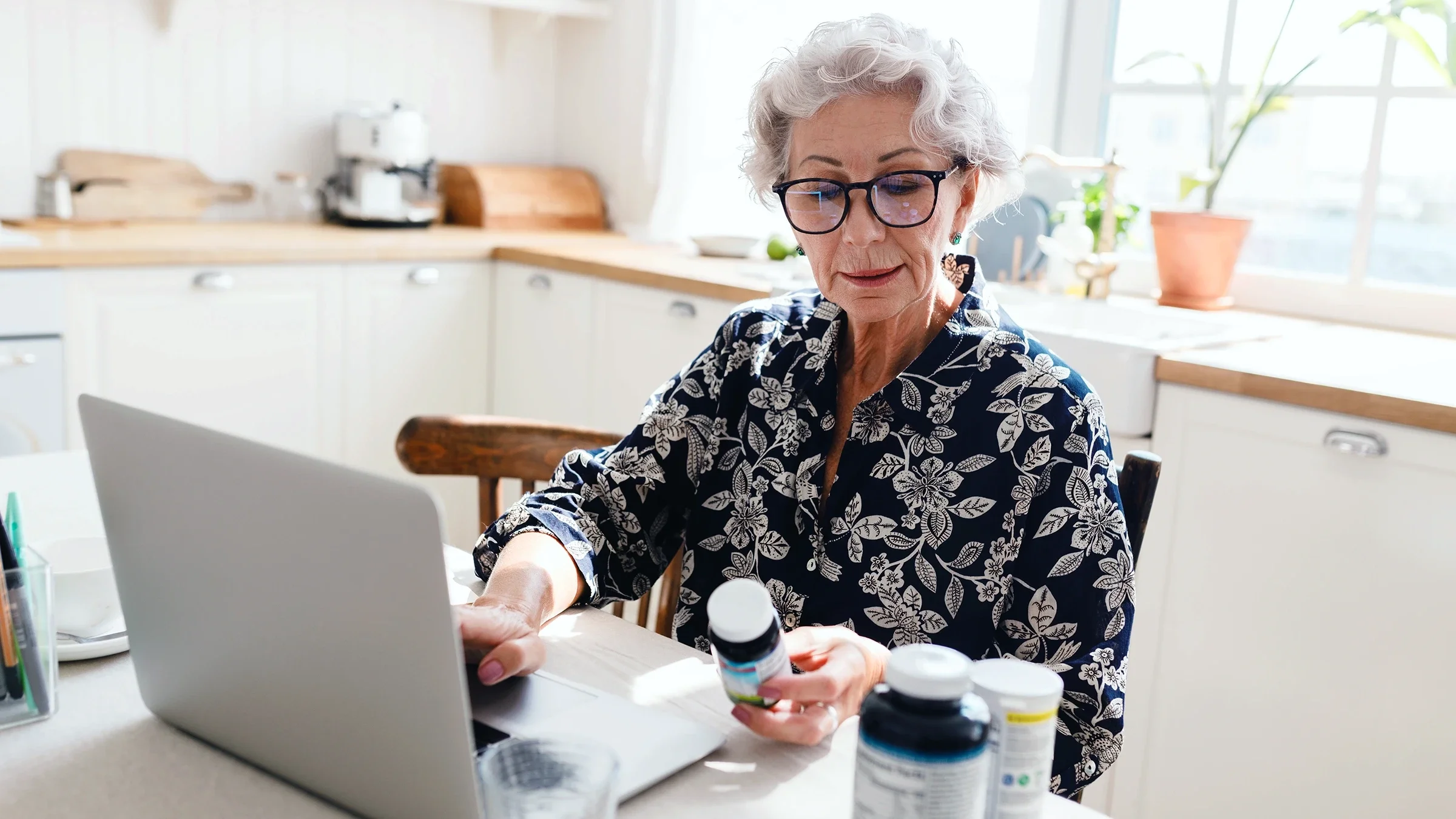 Woman reading supplement bottle.