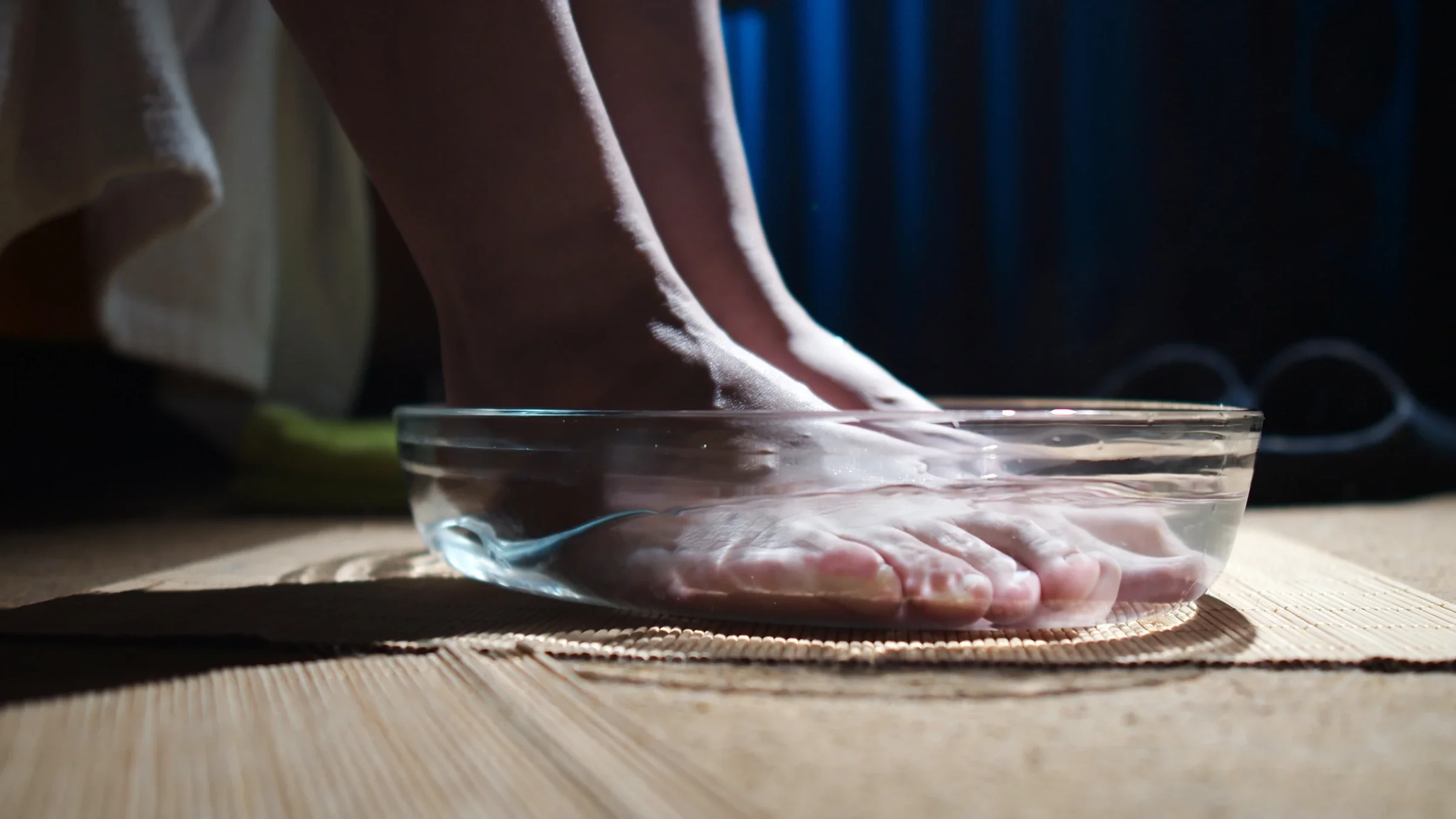 A person is soaking their feet in water.