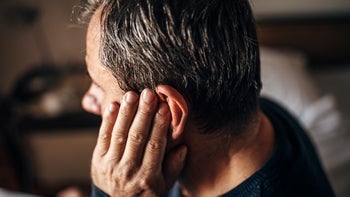 Side effects: closeup man ear pain 1300865464