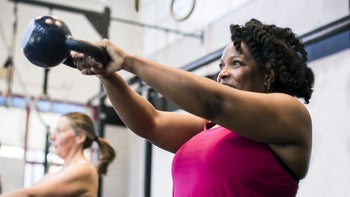 Health: Movement and exercise: woman kettlebell exercise 1255103212