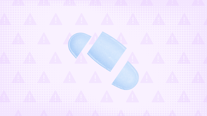 In the center of a light purple background with texture and warning sign pattern is a blue oblong pill cut into thirds. 