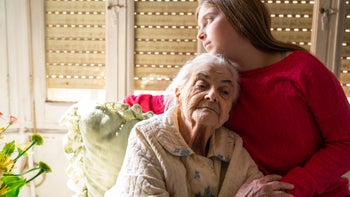 Depression: Genes: grandparent grandchild comforting each other 1173607467