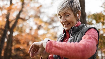 Movement Exercise: senior woman checking smart watch 1354247275