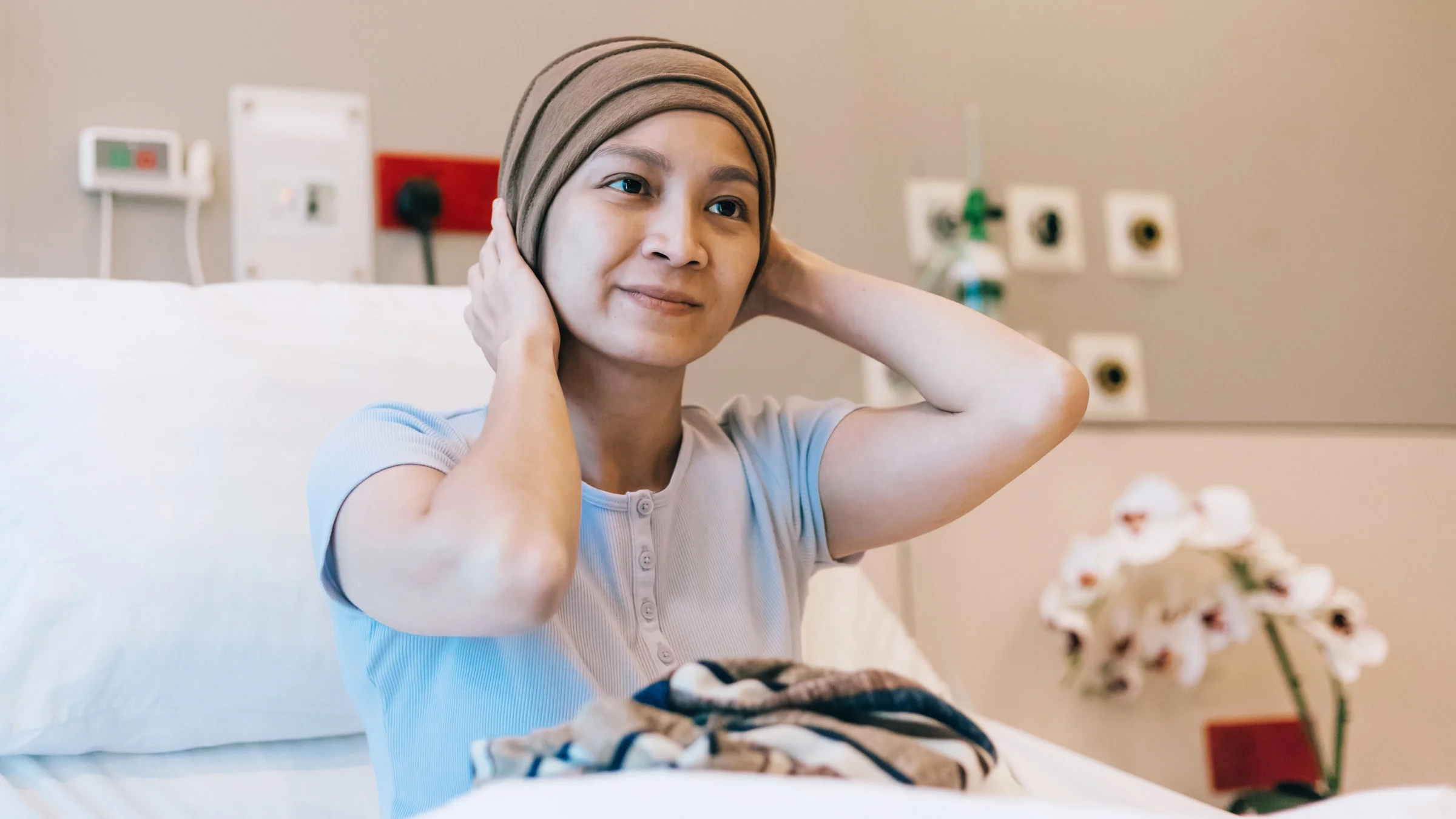 A cancer patient in a hospital bed.