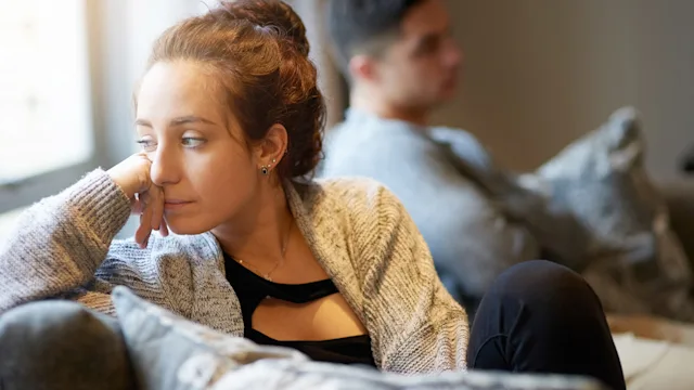 Mental health: Verbal abuse: thinking on couch after argument 624532458