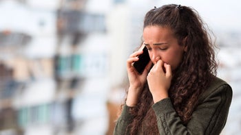 mental health: sad woman on phone 1441429958