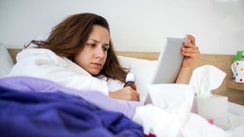 robitussin: woman researching medicine on tablet 501040104