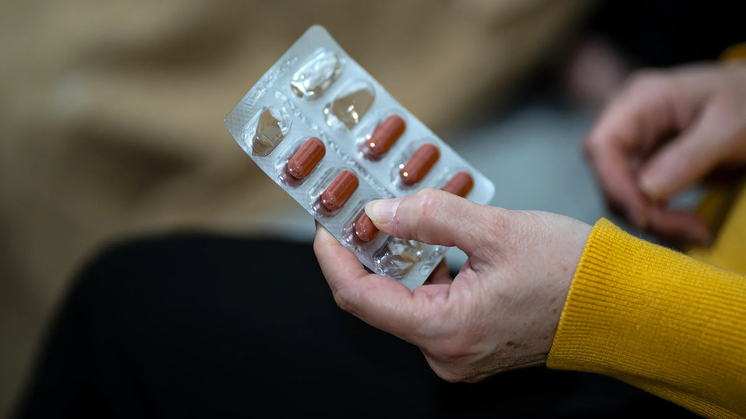 A hand, in close-up, holds a blister pack of pills.
Mihail3/iStock via Getty Images Plus