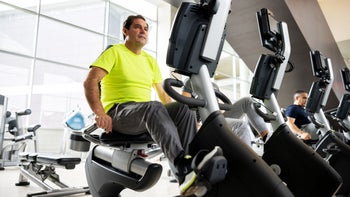 Movement-exercise: man exercising using recumbent bike 1411330449