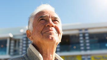 Health: skin cancer: senior man sun looking up-1147281857