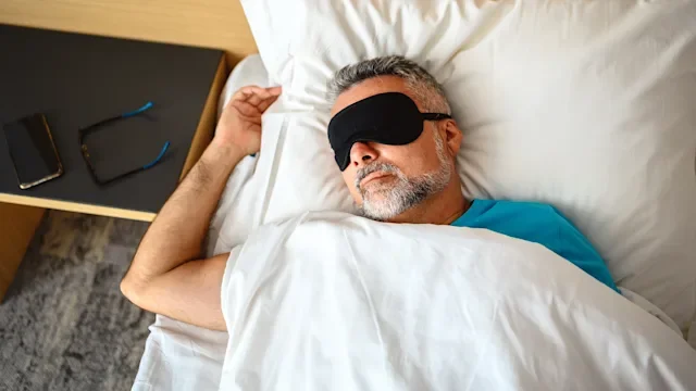 Health: Insomina: man with sleep mask laying down 1272780466
