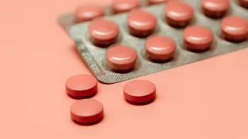 Medication Education: blister pack of pills on colored background 1356149457