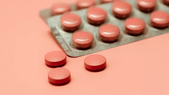 Medication Education: blister pack of pills on colored background 1356149457