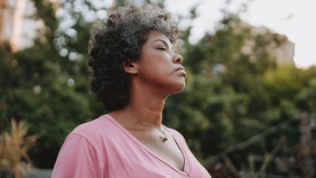 Mental Health: woman taking deep breath 1937522484