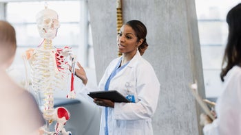 Providers: Side hustles: med school professor explaining anatomy skeleton 1376575389