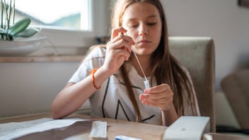 COVID-19: twice: doing at-home covid test 1337482313