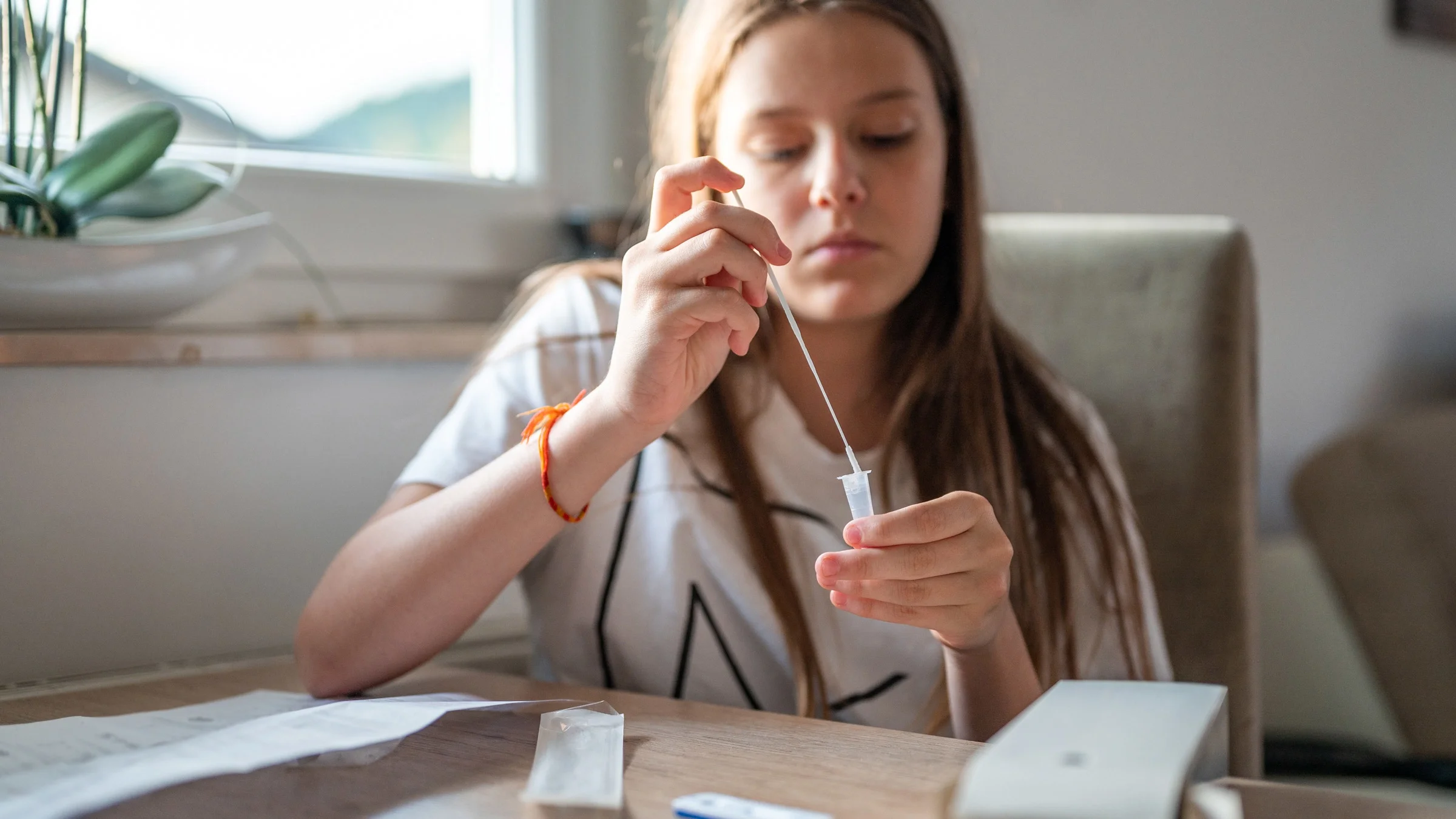 Sick person doing at-home COVID-19 test.