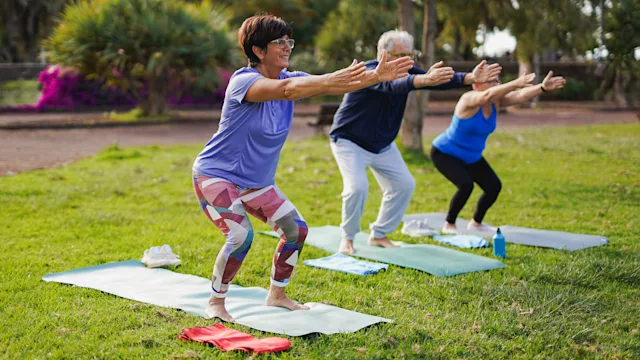 Movement-exercise: yoga class doing chair pose 1954889833