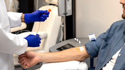 A catheter is being inserted into a person’s vein in a close-up.
Zinkevych /iStock via Getty Images Plus
