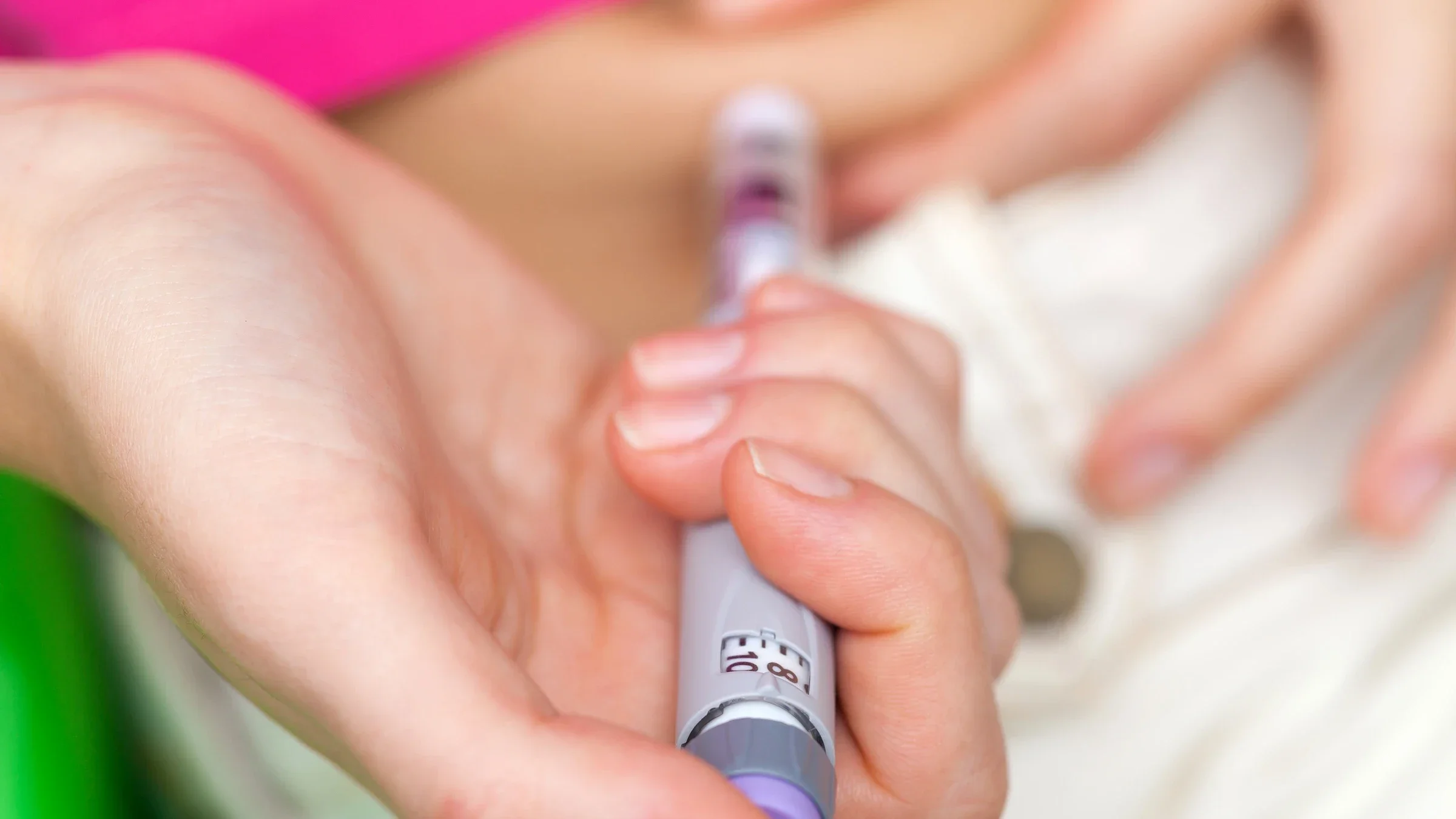 Close-up of woman injecting insulin.
dem10/iStock via Getty Images Plus   