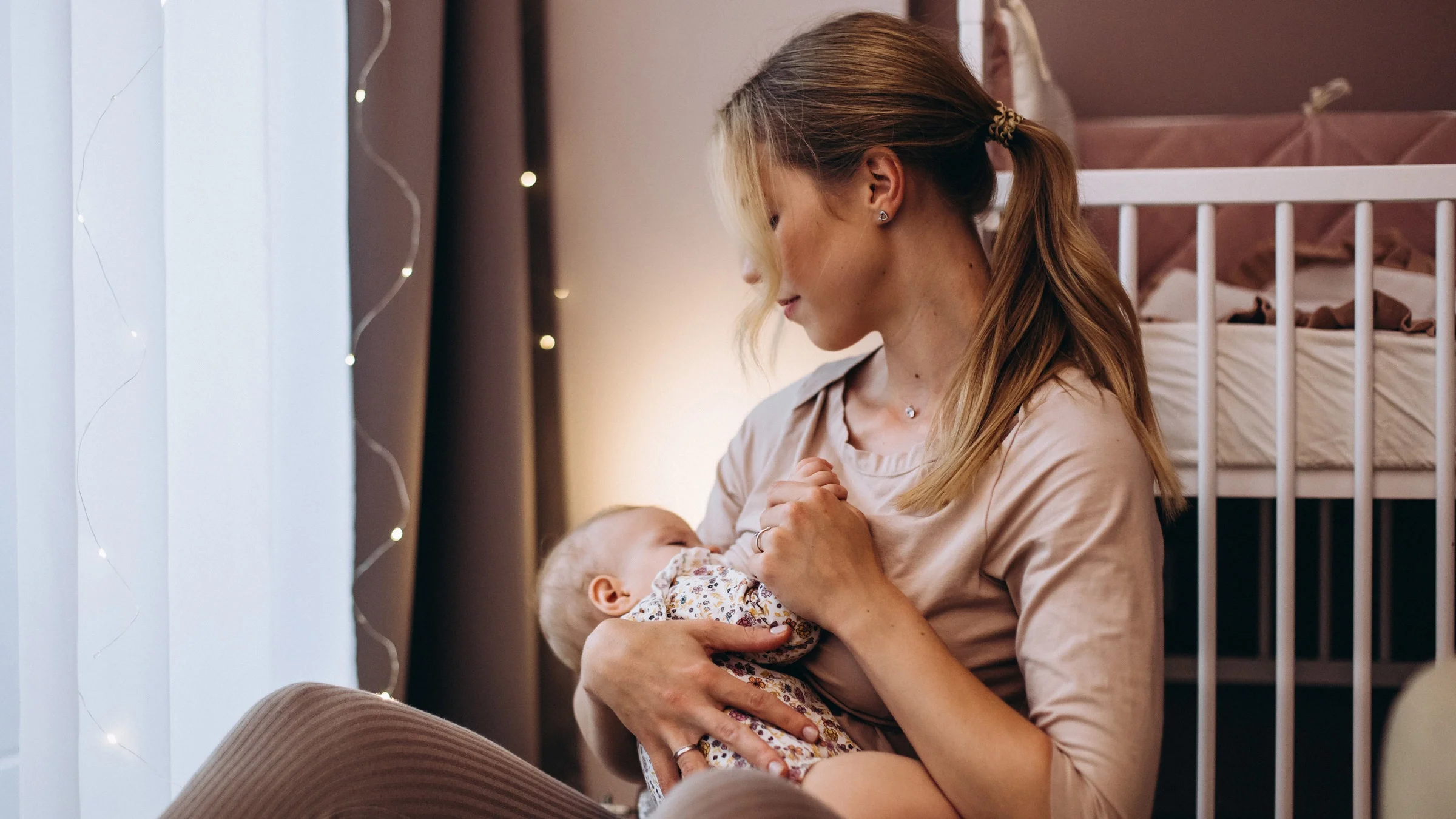 A mother breastfeeds her baby.