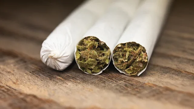 Glaucoma: marijuana: joints on wooden background 1454419008