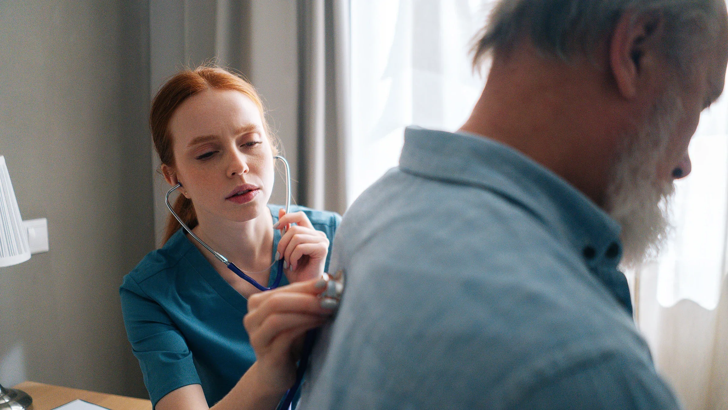 Close-up of doctor examining lungs of older patient at home using stethoscope
dikushin/iStock via Getty Images Plus 