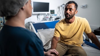 Depression: man listening to medical professional 1492668069
