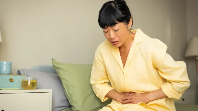 Linzess: woman with abdominal pain)2223728565