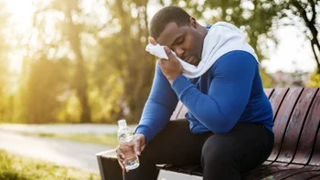 Movement exercise: man wiping sweat after exercise 1319088492