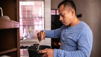 Diet and nutrition: man cooking at home 1368249782