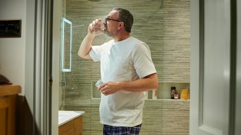 Sertraline: Premature ejaculation: man taking pill in bathroom before bedtime 1292005082