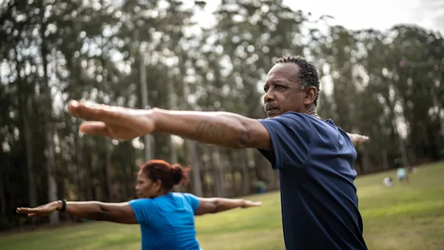 Black health: man and woman practicing yoga 1415828699