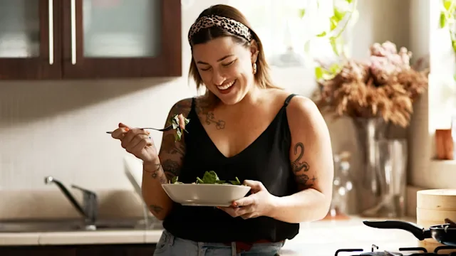 Diet Nutrition: woman eating a salad 1199650379