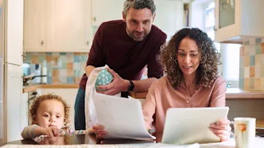 ACA: family doing finances 1313618311