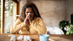 Woman blowing nose with tissues
FG Trade/E+ via Getty Images