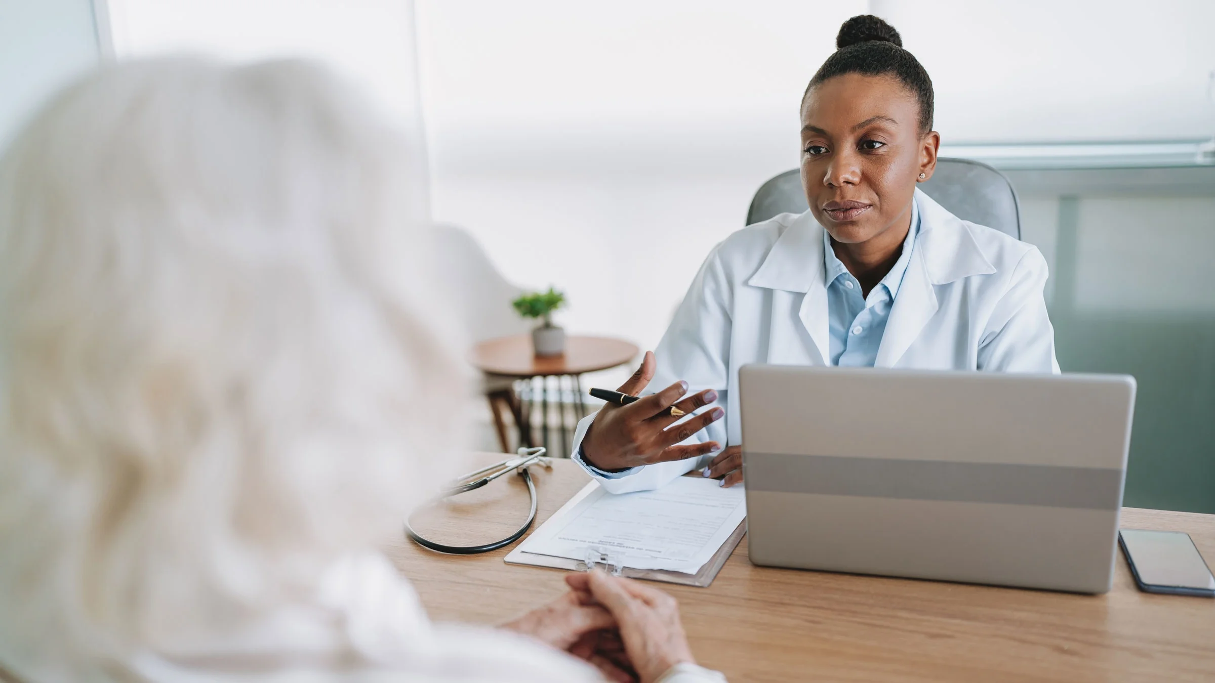 A medical professional discusses medication options with a patient.