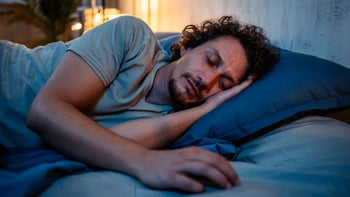 quviviq: man sleeping in bed 1693527912