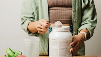 supplements-herbs: closeup woman scooping supplement powder 1706266787