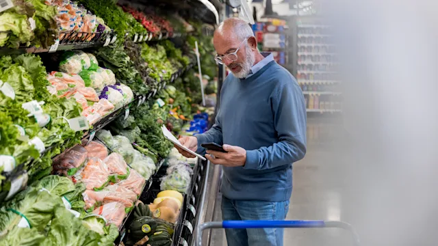 post-surgical-care: man looks at grocery list 1168467384