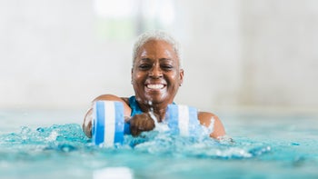 Medicare: Silver&Fit: one woman water aerobics-530872337