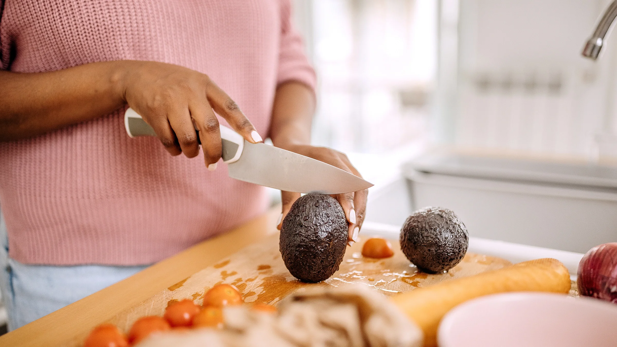 Close-up of slicing an avocado
