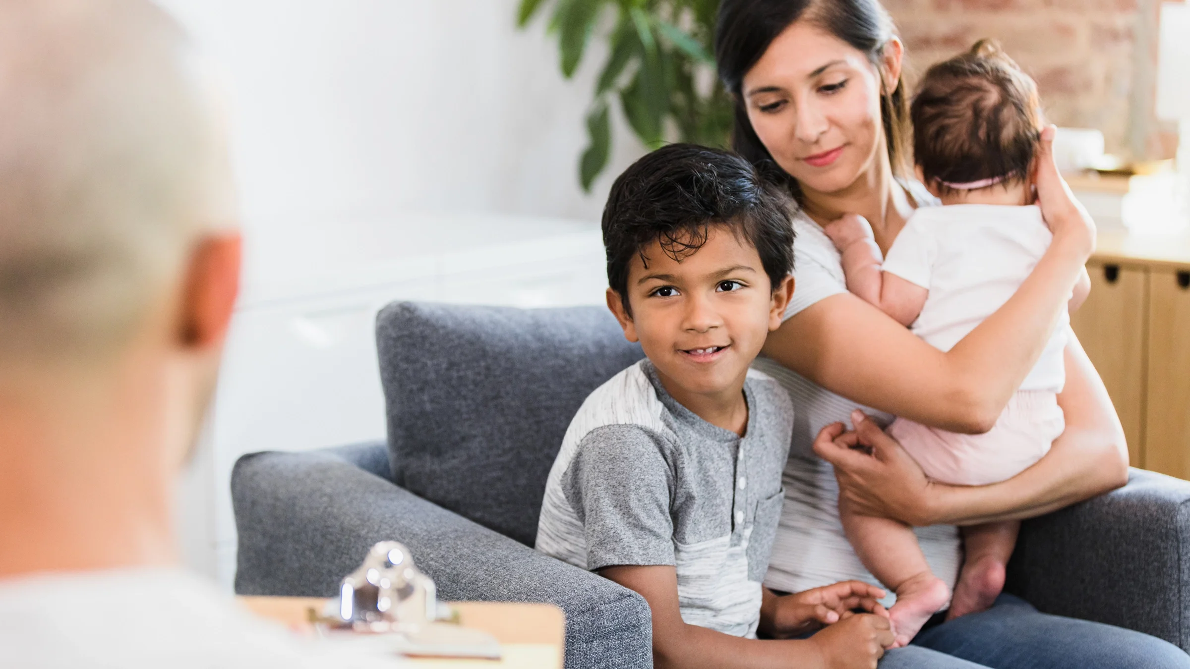 A mother and her son attend a therapy session.